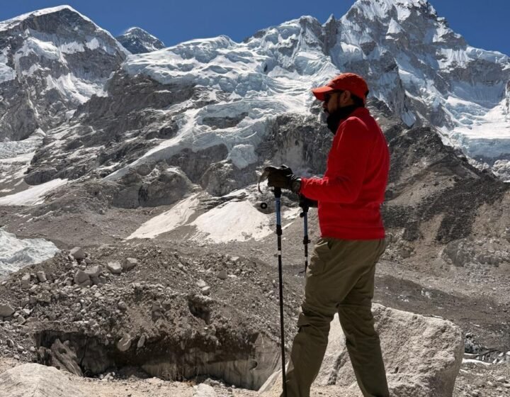 Trekker hiking along a scenic mountain ridge trail during the Everest Base Camp trek difficulty journey