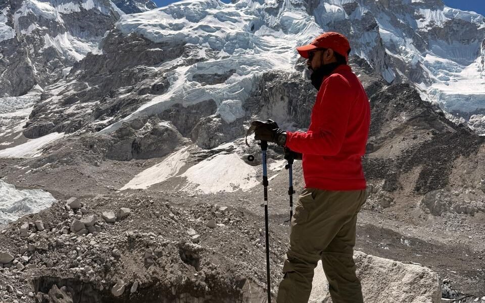 Trekker hiking along a scenic mountain ridge trail during the Everest Base Camp trek difficulty journey