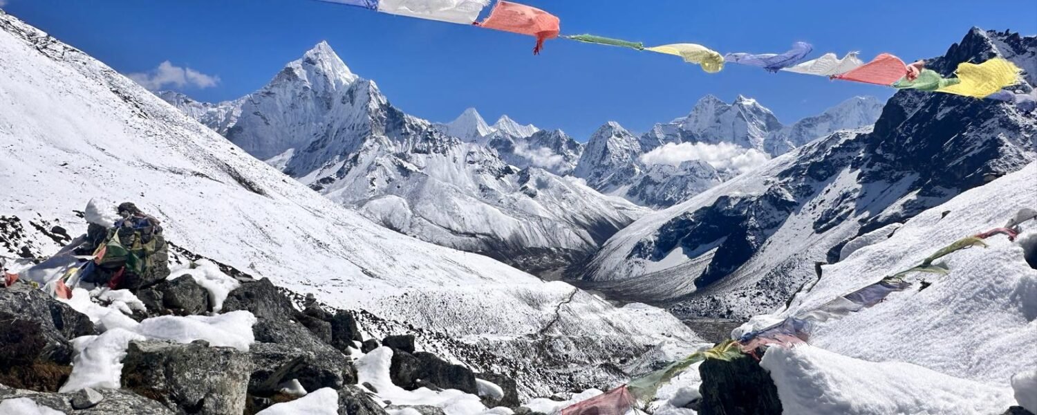 Trekkers crossing a high mountain pass on the Everest Three Passes Trek
