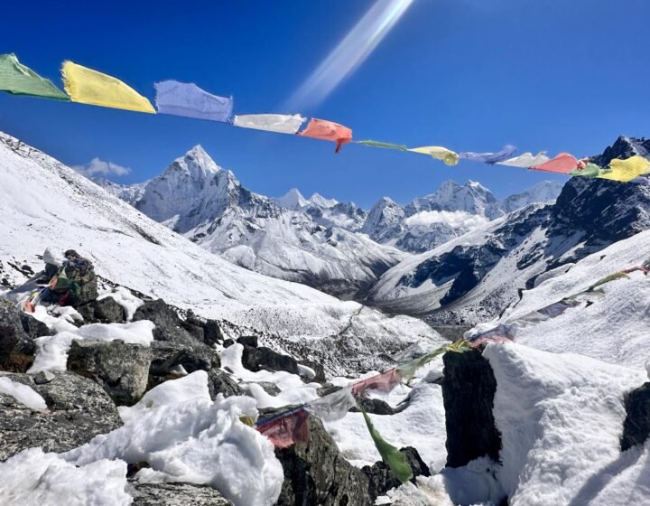 Trekkers crossing a high mountain pass on the Everest Three Passes Trek